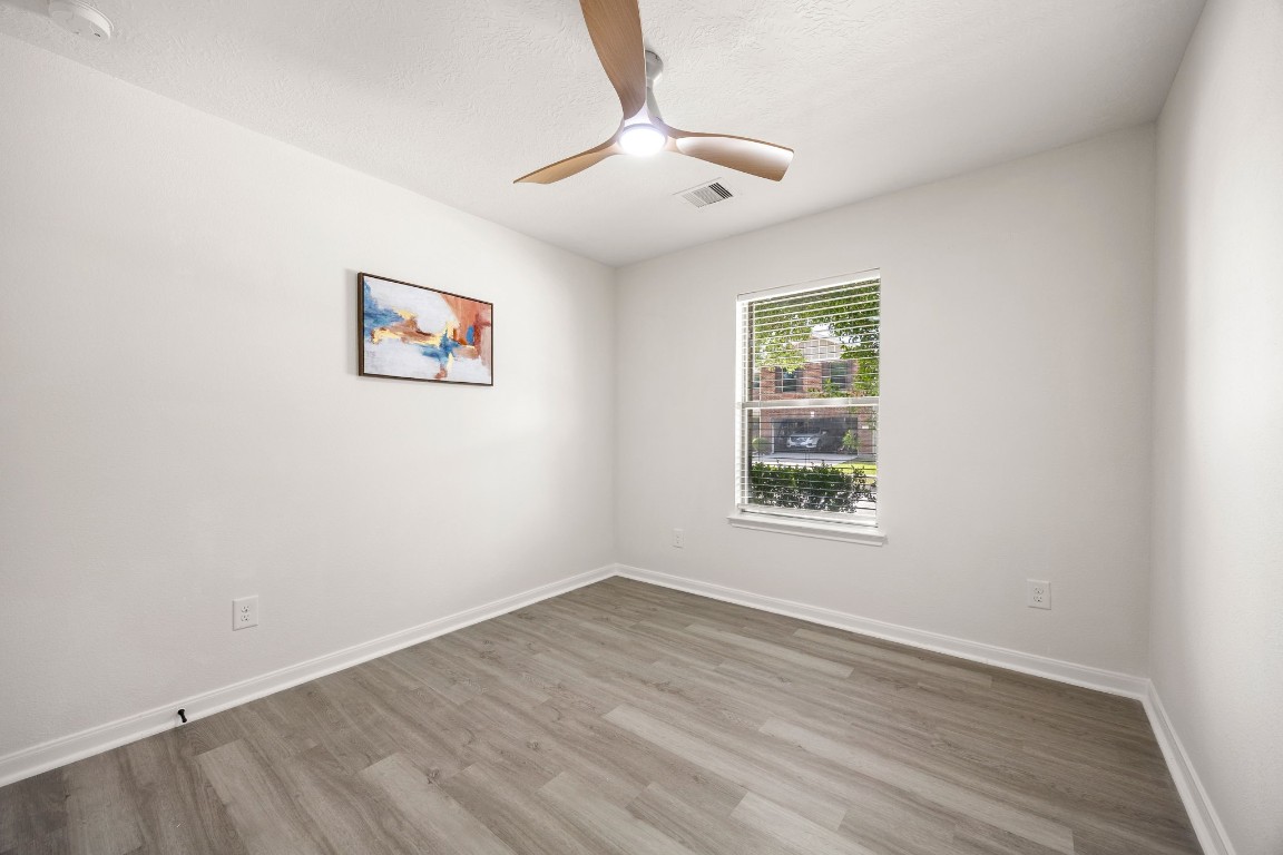1010 Hummingbird Point Lane Houston, TX 77090 - Photo 18 of 26 Additional bedroom with great natural light and functional layout.