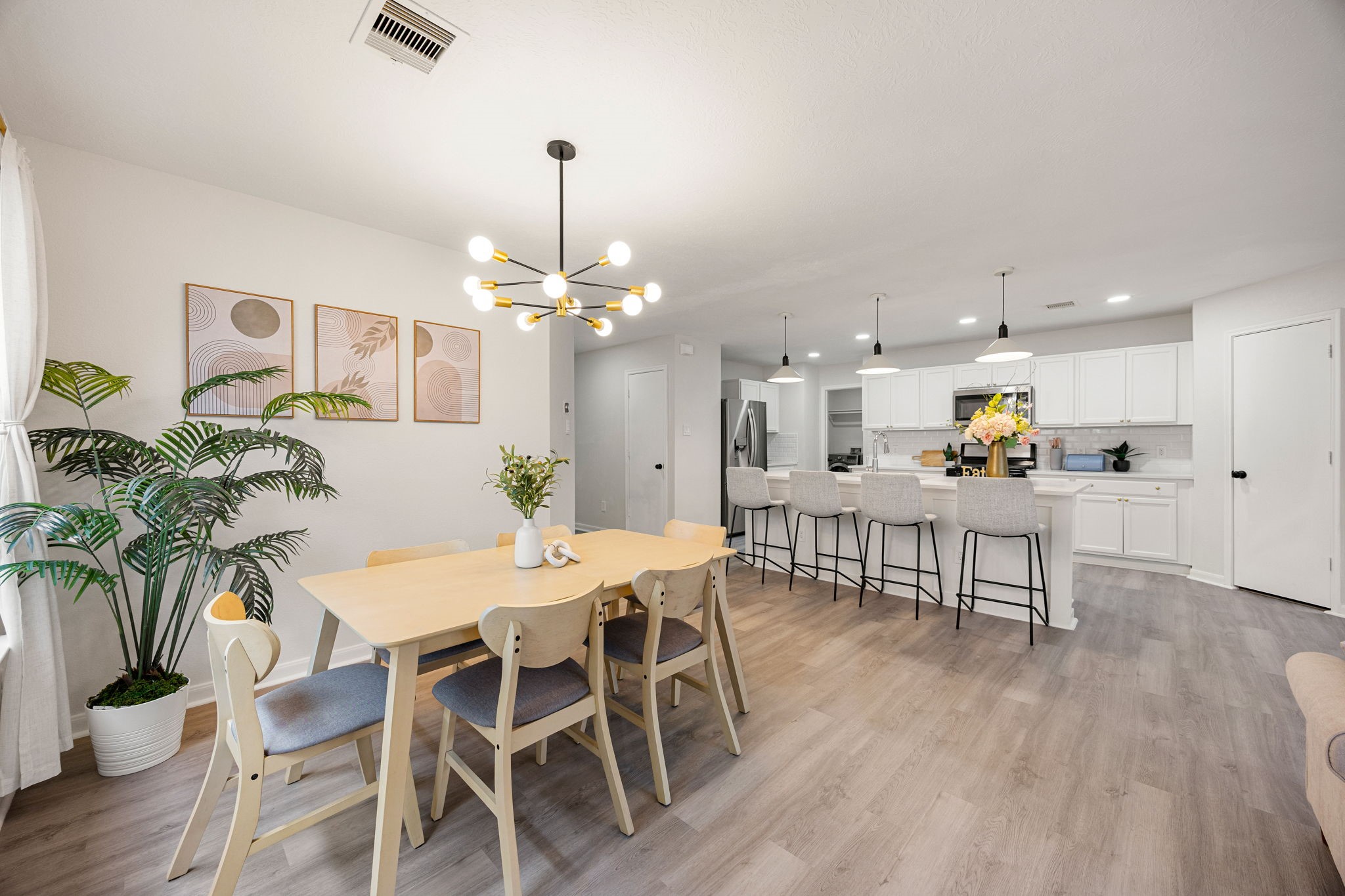 1010 Hummingbird Point Lane Houston, TX 77090 - Photo 9 of 26 No carpet—new vinyl flooring throughout for easy maintenance and modern appeal.