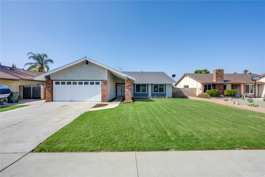 4104 Midland Road Riverside, CA 92505 - Photo 1 of 1 a front view of a house with a yard and garage
