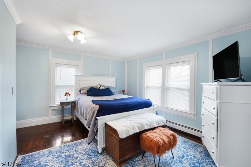 322 Berkshire Valley Road Wharton, NJ 07885 - Photo 16 of 30 a bedroom with a bed and flat screen tv