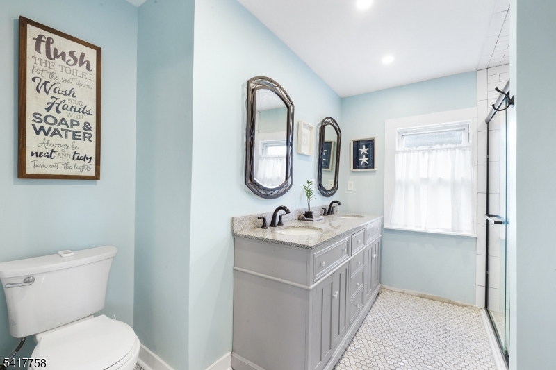 322 Berkshire Valley Road Wharton, NJ 07885 - Photo 19 of 30 a bathroom with a sink a toilet and a mirror