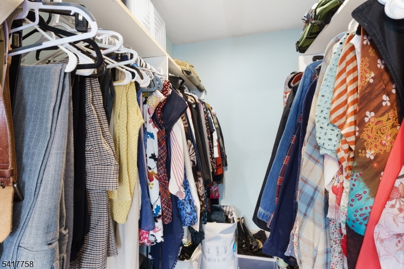 322 Berkshire Valley Road Wharton, NJ 07885 - Photo 20 of 30 a view of walk in closet with clothes