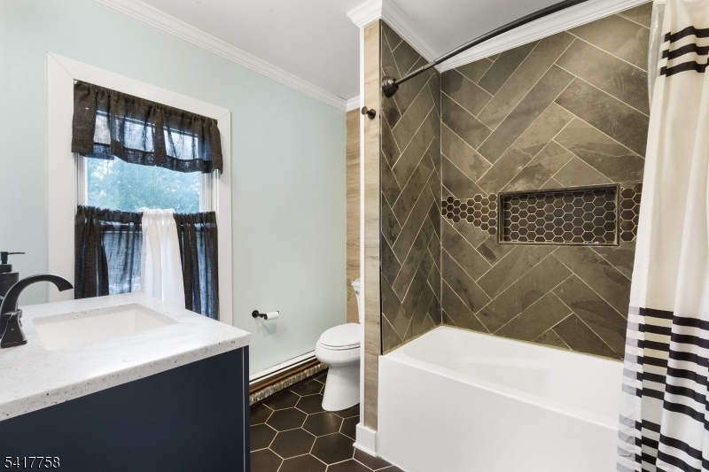 322 Berkshire Valley Road Wharton, NJ 07885 - Photo 22 of 30 a bathroom with a sink a toilet and shower