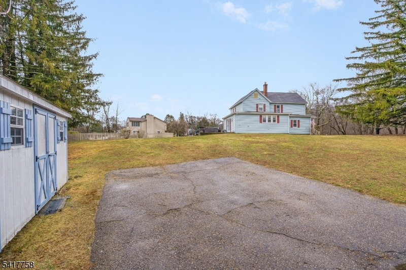 322 Berkshire Valley Road Wharton, NJ 07885 - Photo 26 of 30 a view of a house with a yard and a large tree