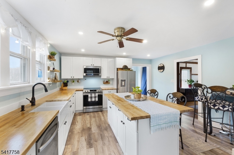 322 Berkshire Valley Road Wharton, NJ 07885 - Photo 4 of 30 a large kitchen with stainless steel appliances a stove a sink a refrigerator and a refrigerator