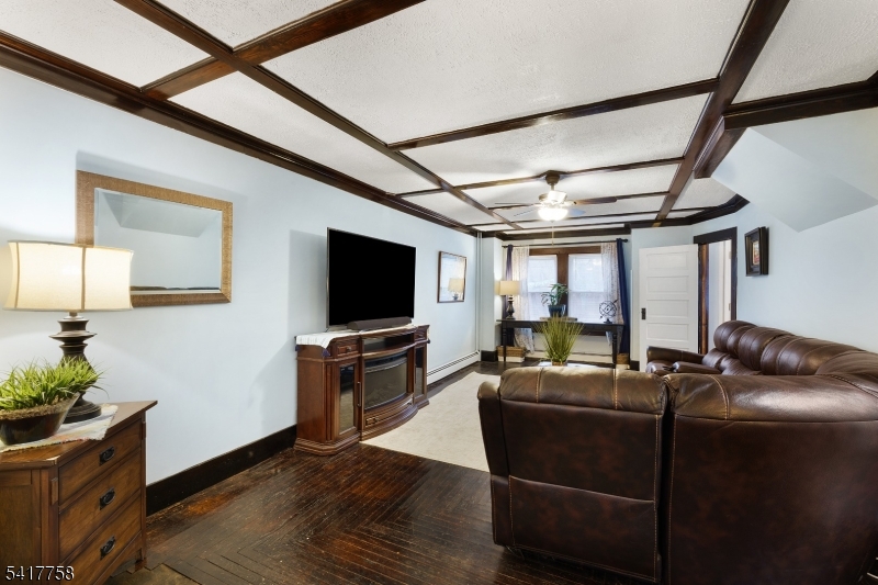 322 Berkshire Valley Road Wharton, NJ 07885 - Photo 8 of 30 a living room with furniture and a flat screen tv