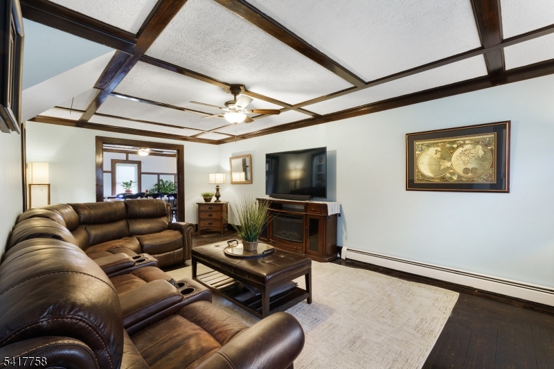 322 Berkshire Valley Road Wharton, NJ 07885 - Photo 9 of 30 a living room with furniture and a flat screen tv
