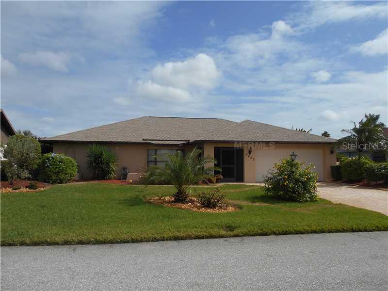5843 Lincoln Road Venice, FL 34293 - Photo 1 of 1 a front view of a house with a garden