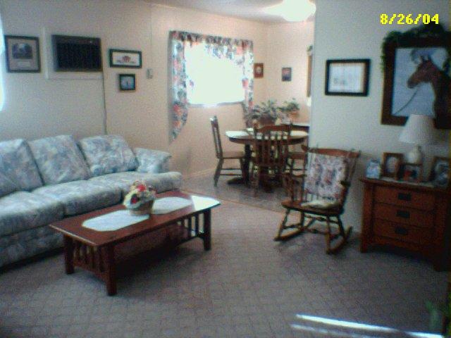 5103 South Bonham Street Amarillo, TX 79110 - Photo 3 of 3 a living room with furniture and a dining table