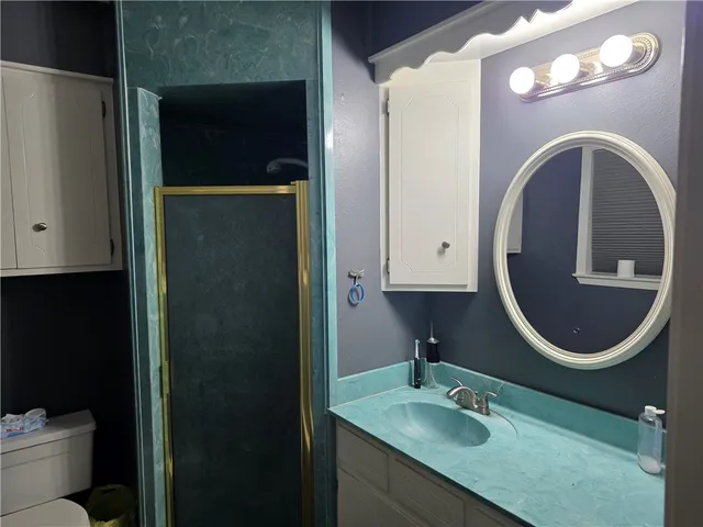 a bathroom with a sink double vanity and a mirror