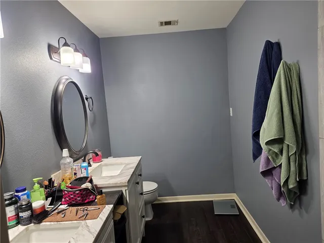 a bathroom with a sink mirror and vanity