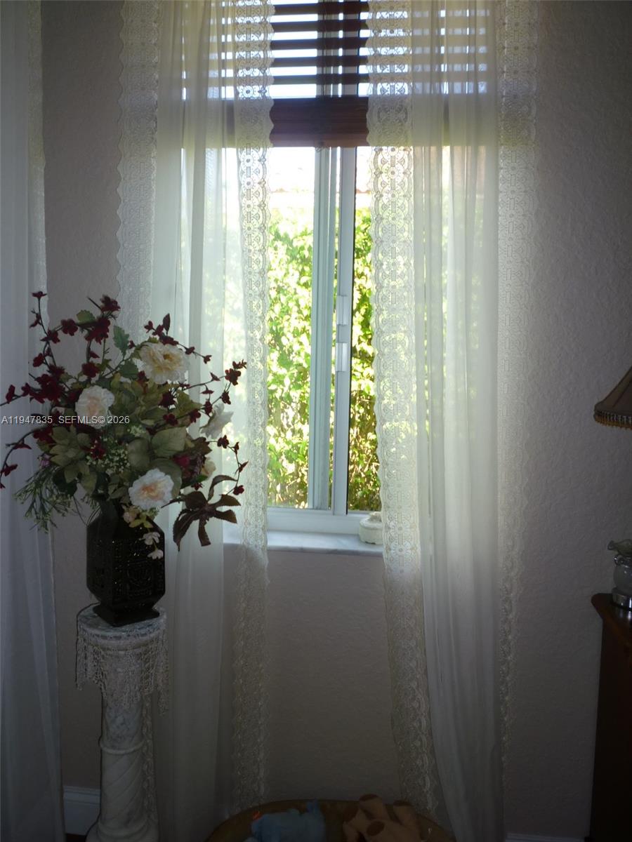 644 Conservation Drive Weston, FL 33327 - Photo 12 of 24 a view of a flower pot