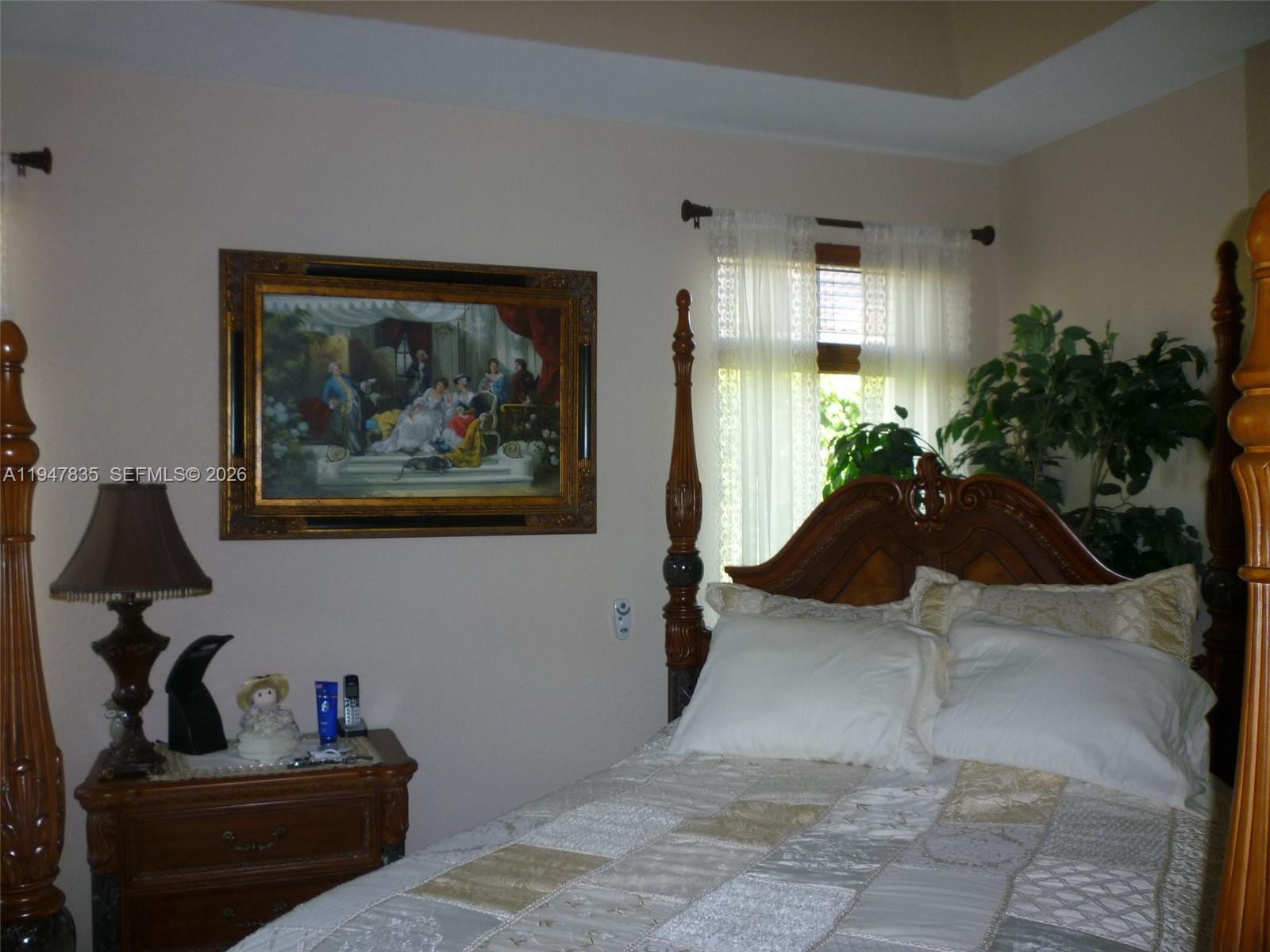 644 Conservation Drive Weston, FL 33327 - Photo 13 of 24 a living room with furniture and a potted plant