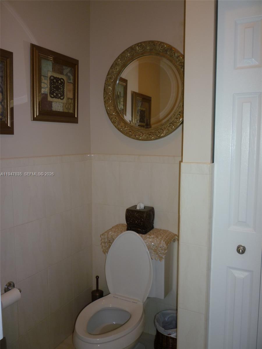 644 Conservation Drive Weston, FL 33327 - Photo 15 of 24 a bathroom with a toilet and a sink