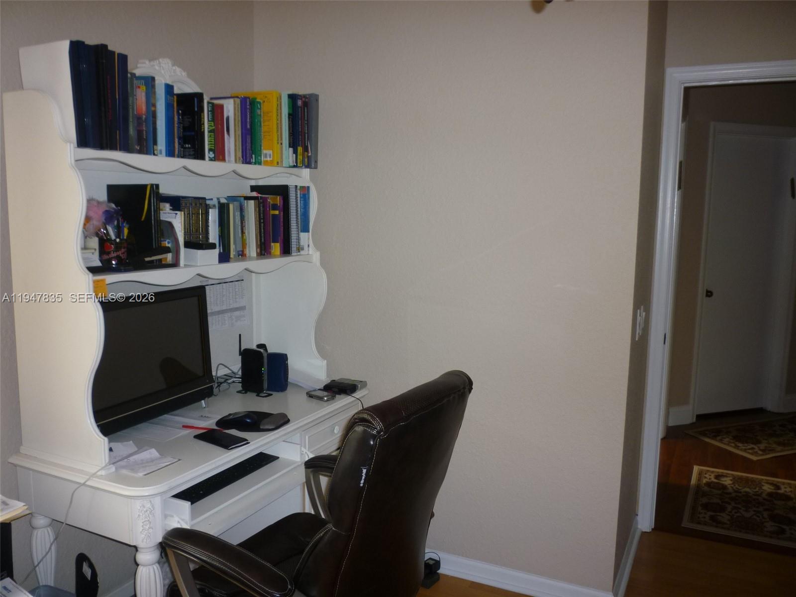 644 Conservation Drive Weston, FL 33327 - Photo 24 of 24 a view of a workspace with furniture