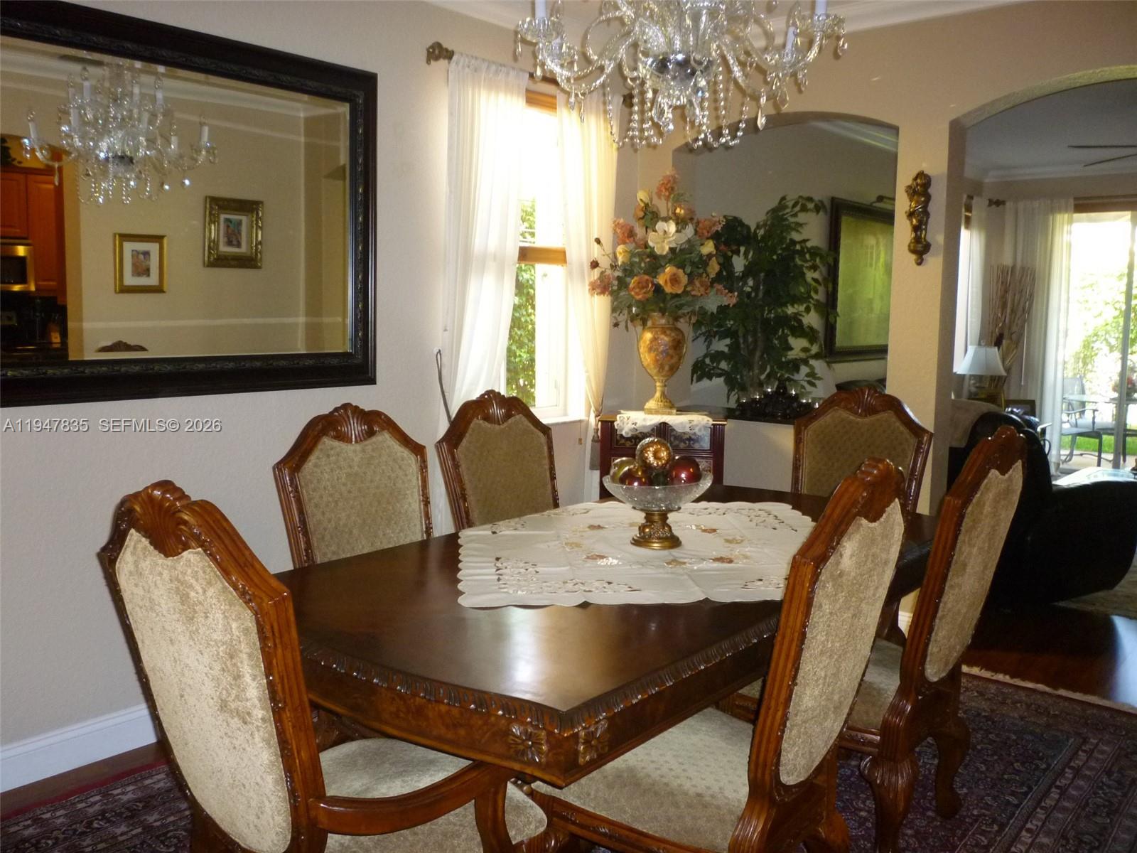 644 Conservation Drive Weston, FL 33327 - Photo 3 of 24 a view of a dining room with furniture and window