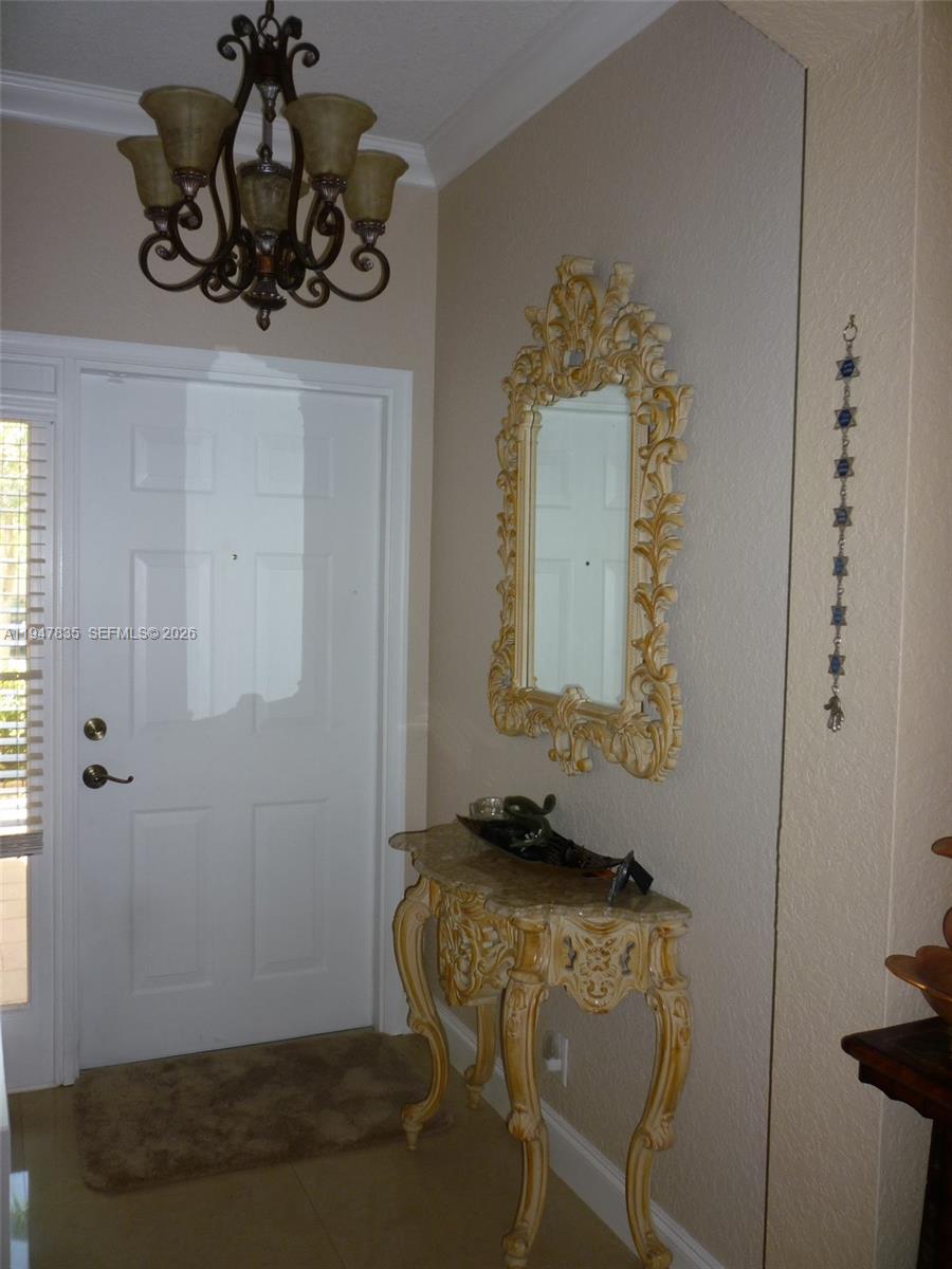 644 Conservation Drive Weston, FL 33327 - Photo 4 of 24 a bathroom with a sink and mirror