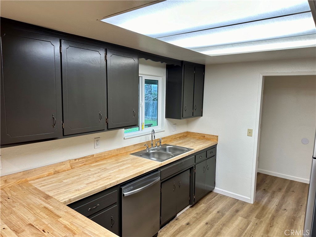 1231 7th Street Livingston, CA 95334 - Photo 18 of 39 a kitchen with a sink and cabinets