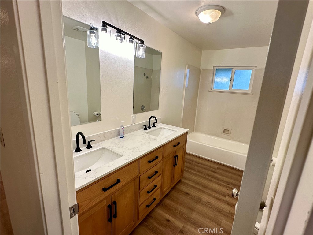 1231 7th Street Livingston, CA 95334 - Photo 21 of 39 a bathroom with a double vanity sink and a mirror