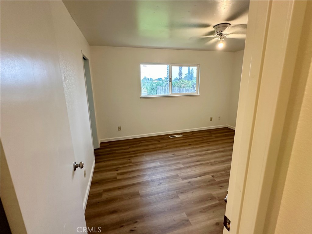 1231 7th Street Livingston, CA 95334 - Photo 26 of 39 a view of a room with wooden floor and white walls