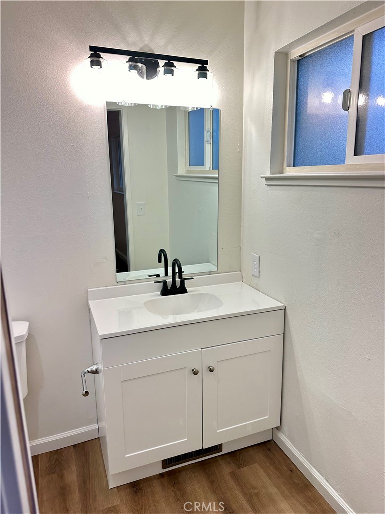 1231 7th Street Livingston, CA 95334 - Photo 28 of 39 a bathroom with a sink and a mirror