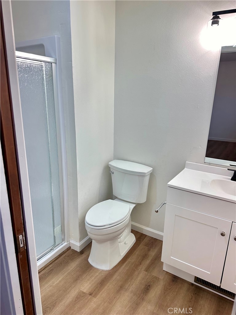 1231 7th Street Livingston, CA 95334 - Photo 30 of 39 a white toilet sitting next to a sink