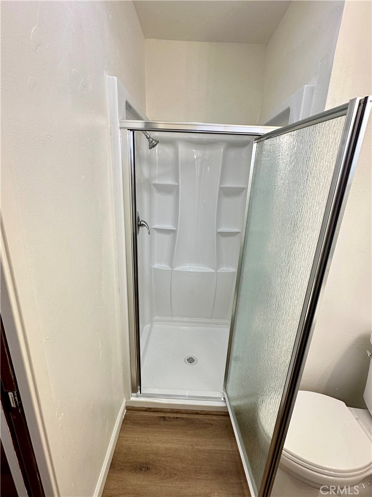 1231 7th Street Livingston, CA 95334 - Photo 31 of 39 a bathroom with a glass door shower