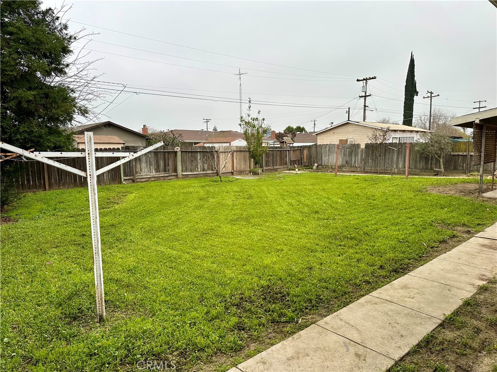 1231 7th Street Livingston, CA 95334 - Photo 32 of 39 a view of a garden with lawn chairs