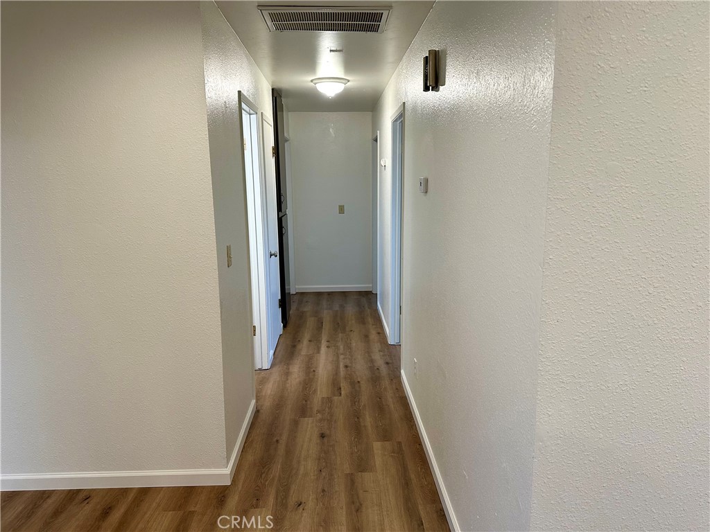 1231 7th Street Livingston, CA 95334 - Photo 10 of 39 a view of a hallway with wooden floor