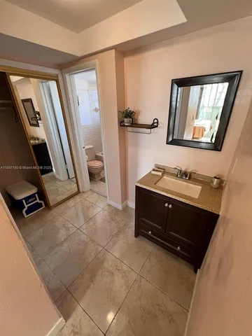 a bathroom with a toilet and a sink