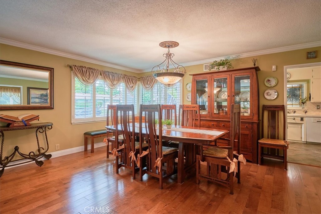 2221 Elsinore Road Riverside, CA 92506 - Photo 13 of 65 a view of a a dining room with furniture window and wooden floor
