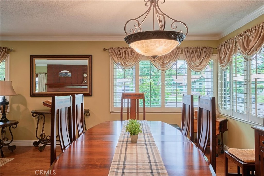 2221 Elsinore Road Riverside, CA 92506 - Photo 14 of 65 a view of a dining room with furniture window and wooden floor