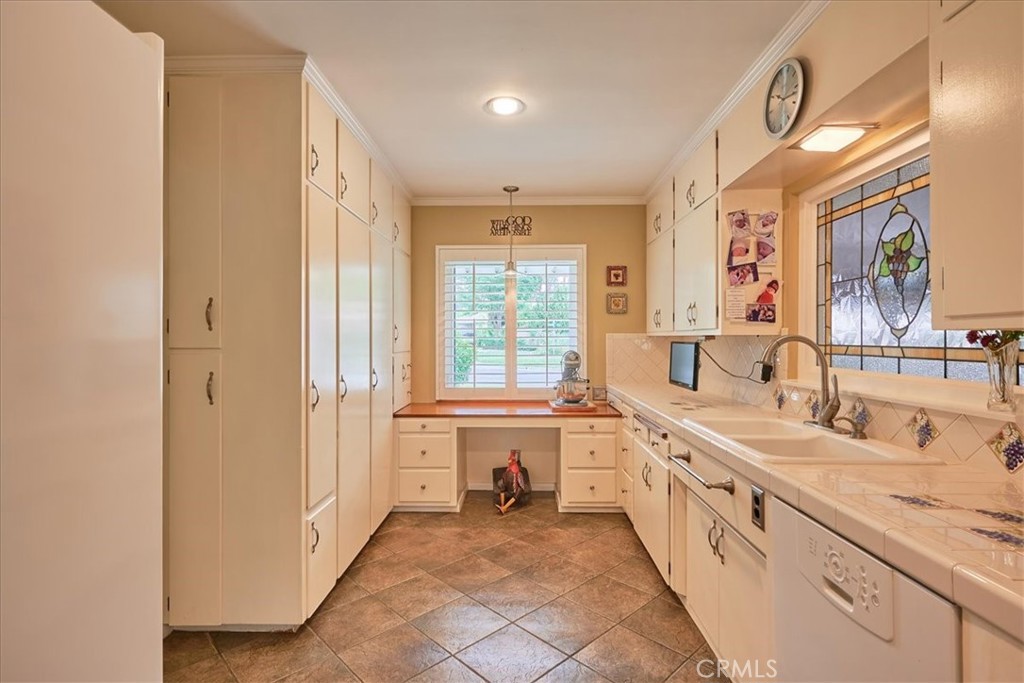 2221 Elsinore Road Riverside, CA 92506 - Photo 19 of 65 a large bathroom with a granite countertop double vanity sink a mirror and a bathtub