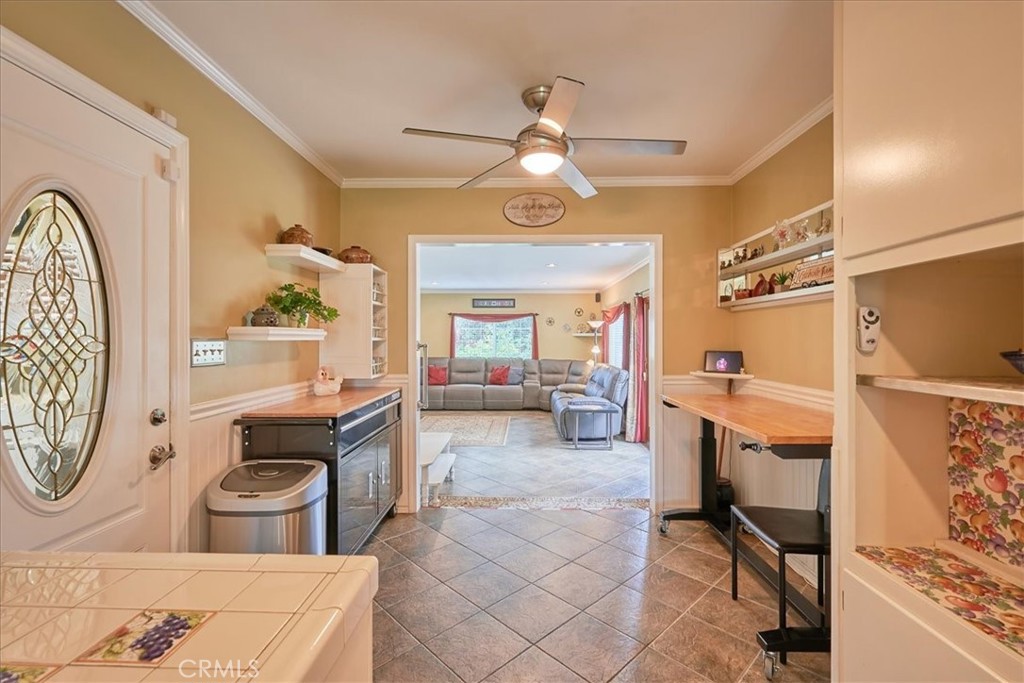 2221 Elsinore Road Riverside, CA 92506 - Photo 21 of 65 a living room with furniture a flat screen tv and a stove