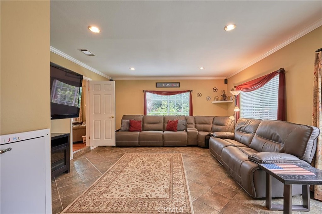 2221 Elsinore Road Riverside, CA 92506 - Photo 23 of 65 a living room with furniture and a couch