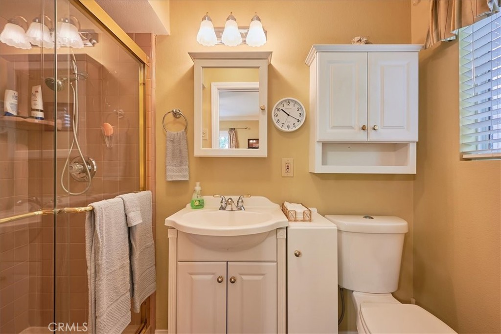 2221 Elsinore Road Riverside, CA 92506 - Photo 29 of 65 a bathroom with a sink a toilet and a shower