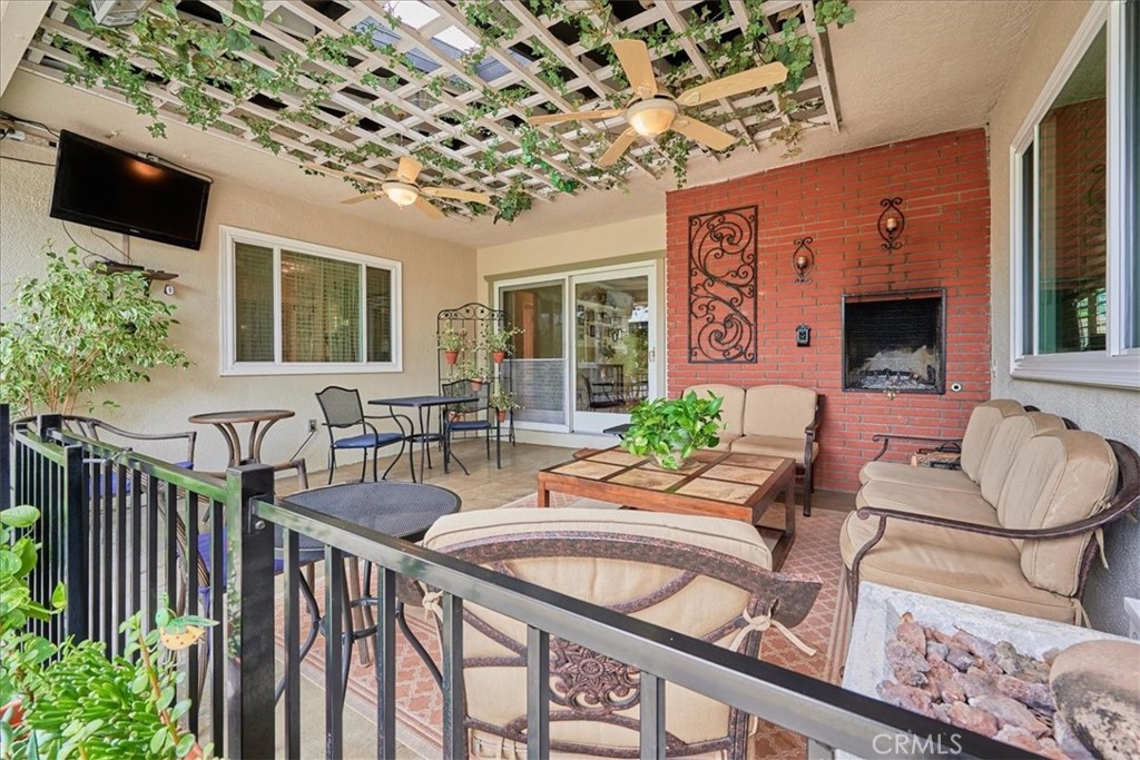 2221 Elsinore Road Riverside, CA 92506 - Photo 49 of 65 a balcony with furniture and potted plants