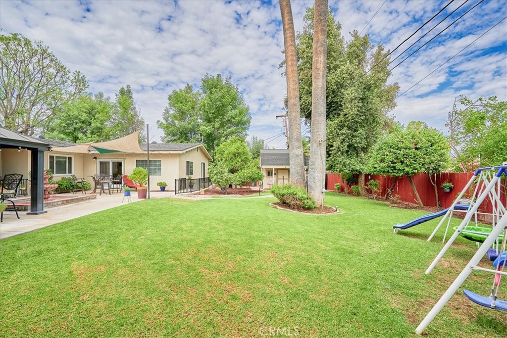 2221 Elsinore Road Riverside, CA 92506 - Photo 54 of 65 a front view of house with yard and outdoor seating