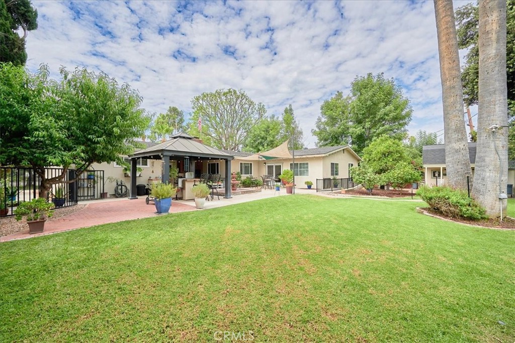 2221 Elsinore Road Riverside, CA 92506 - Photo 55 of 65 a front view of a house with yard and porch