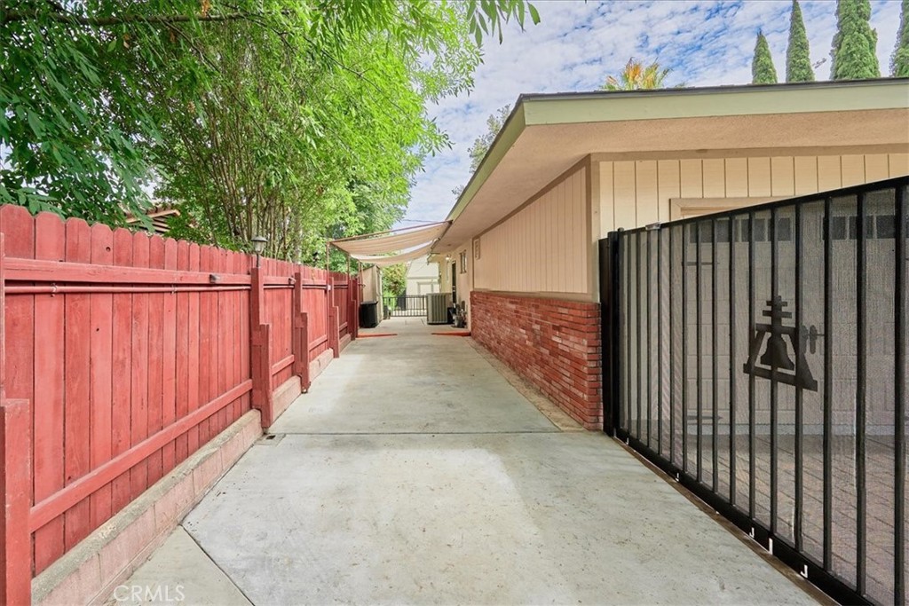 2221 Elsinore Road Riverside, CA 92506 - Photo 61 of 65 a view of a backyard with wooden fence