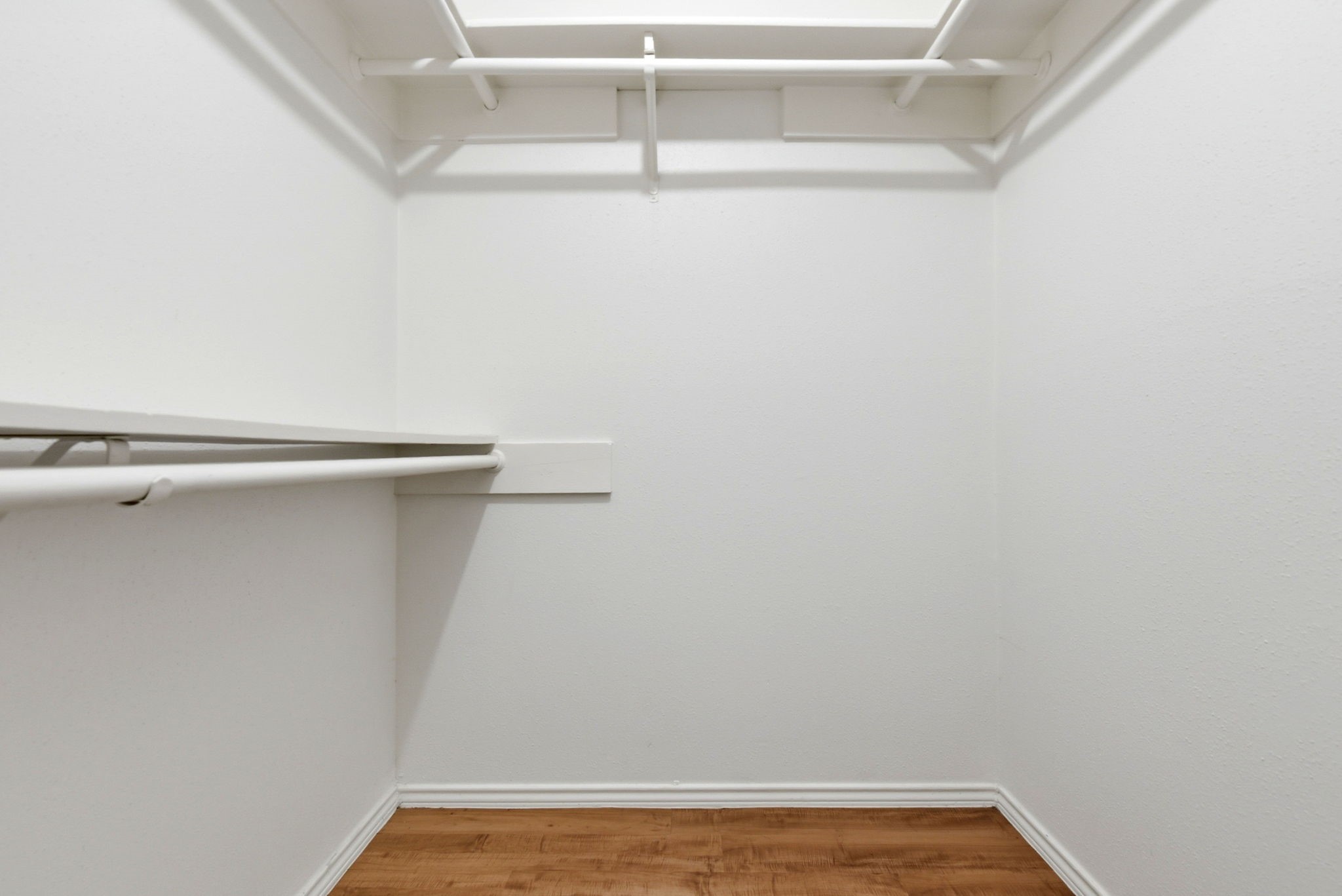 21330 Golden Dove Drive Spring, TX 77388 - Photo 17 of 29 Organization is easy with the spacious primary walk-in closet, complete with built-in hanging racks and shelving.