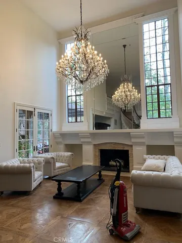 a kitchen with a sink cabinets and wooden floor