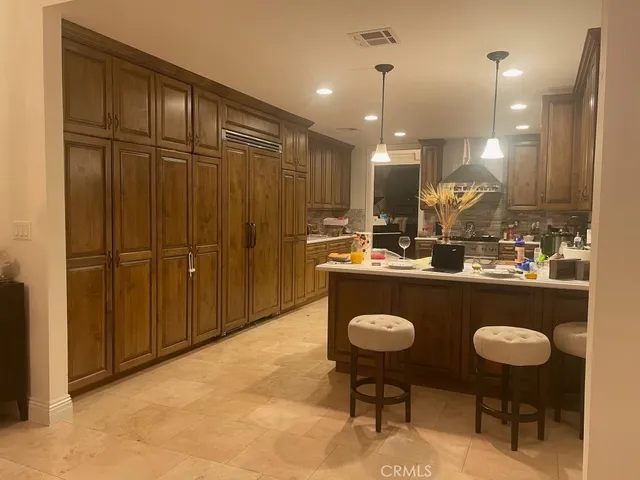 a living room with furniture pool table and flat screen tv