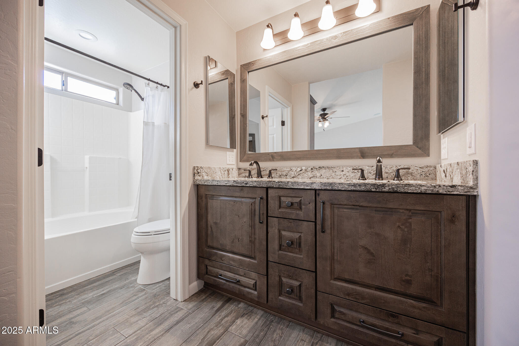 1633 East Beautiful Lane Phoenix, AZ 85042 - Photo 16 of 27 a bathroom with a granite countertop sink toilet and shower
