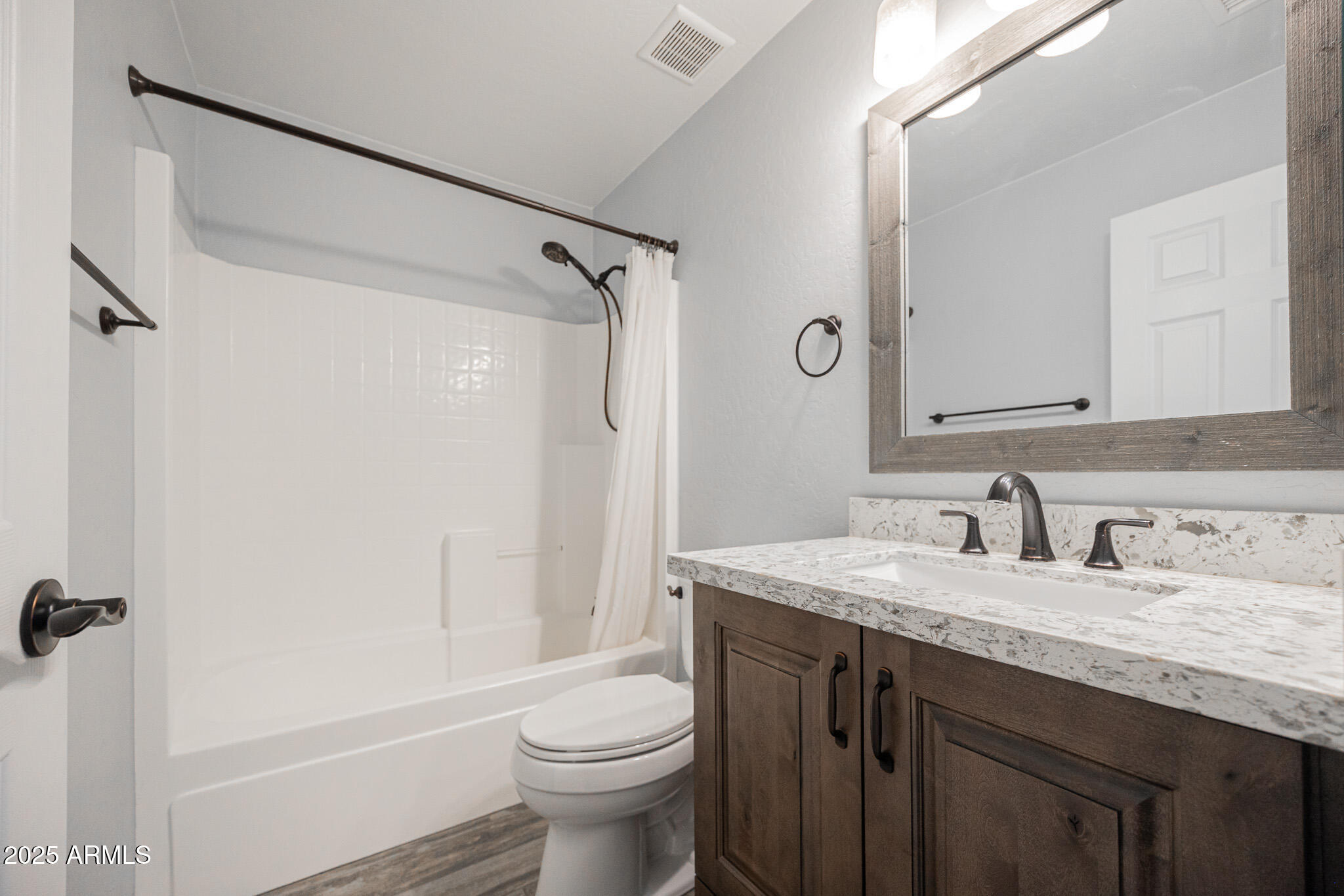 1633 East Beautiful Lane Phoenix, AZ 85042 - Photo 22 of 27 a bathroom with a granite countertop sink toilet and shower