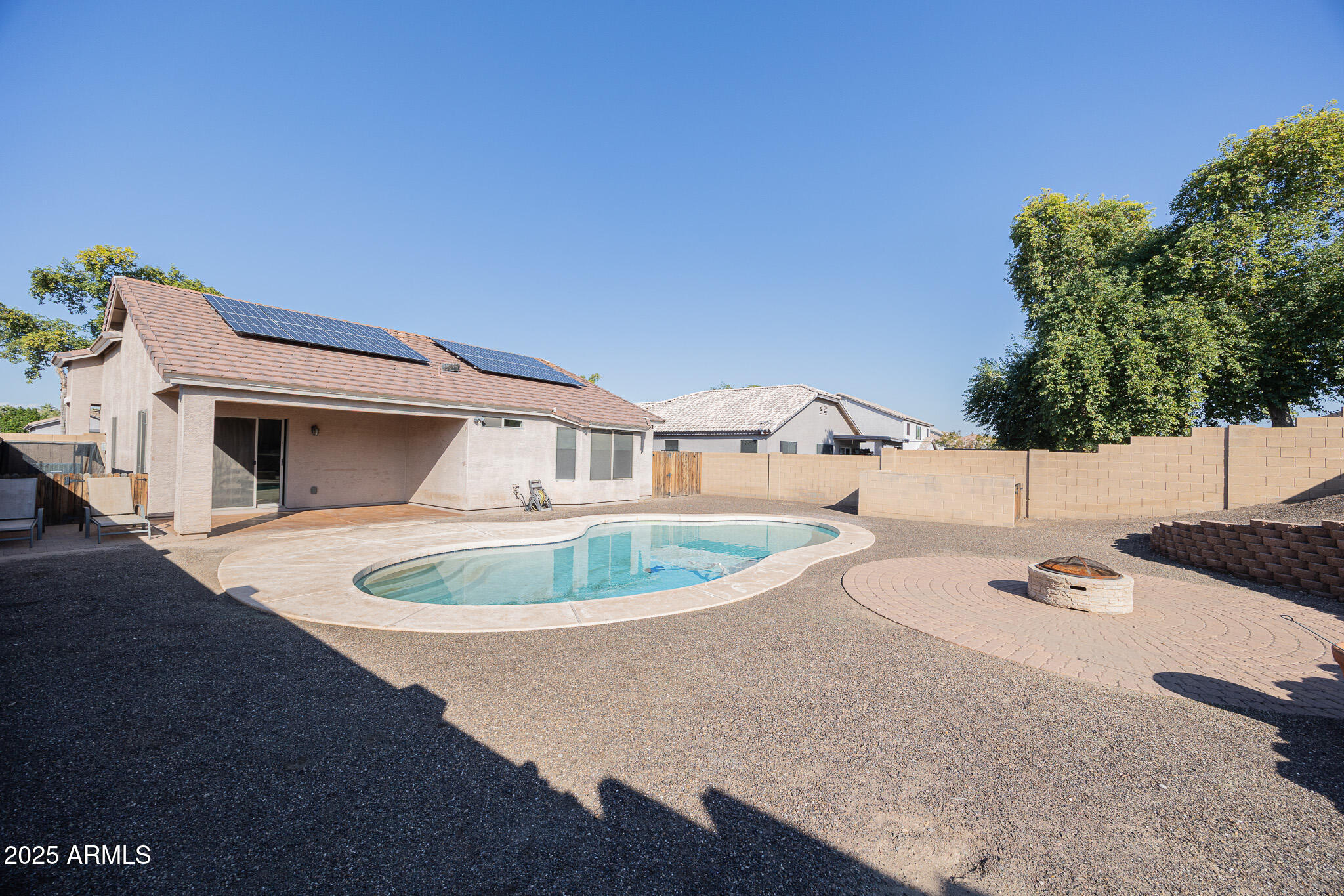 1633 East Beautiful Lane Phoenix, AZ 85042 - Photo 26 of 27 a backyard of a house with outdoor seating