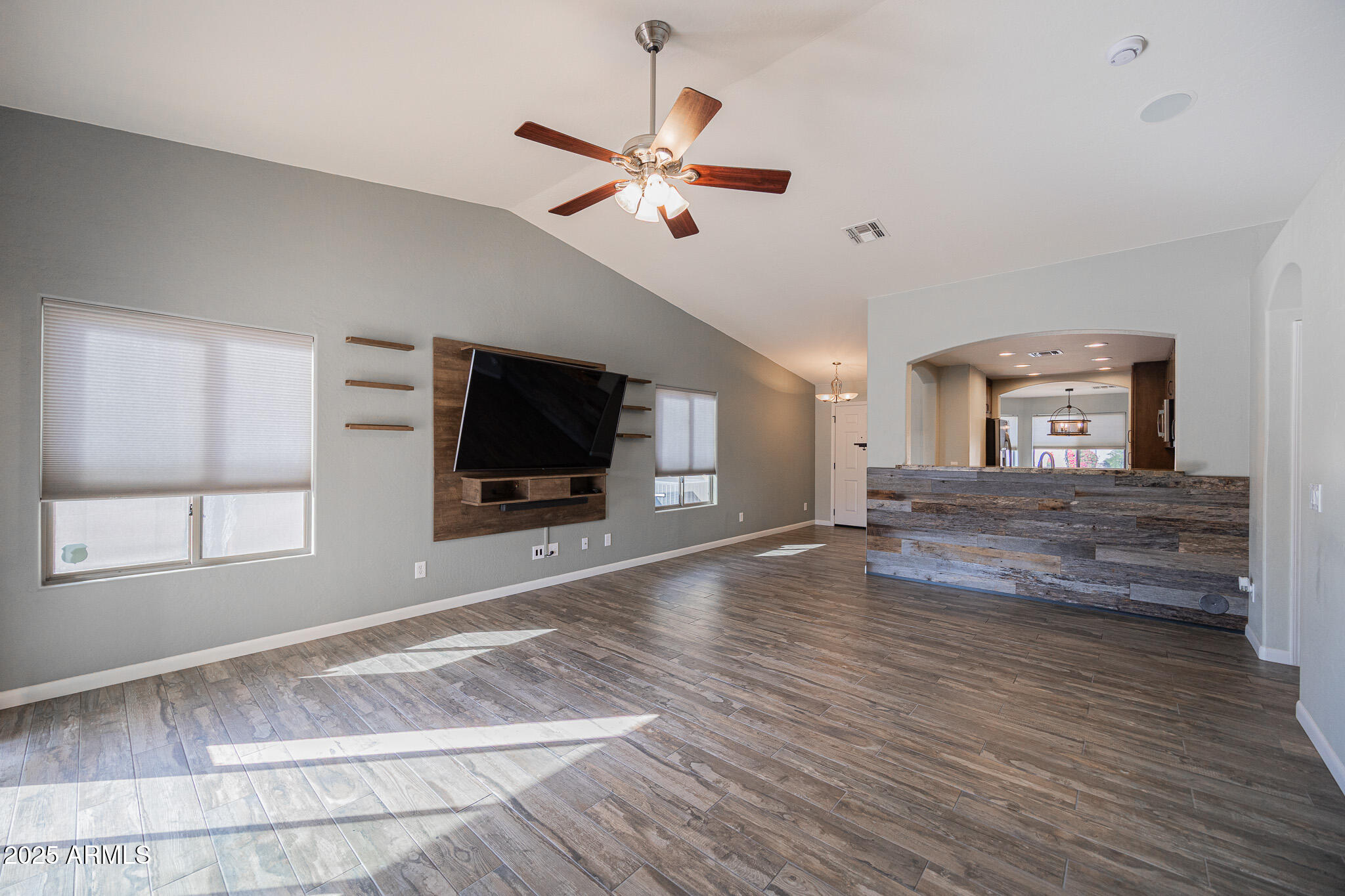 1633 East Beautiful Lane Phoenix, AZ 85042 - Photo 6 of 27 a living room with furniture and a flat screen tv
