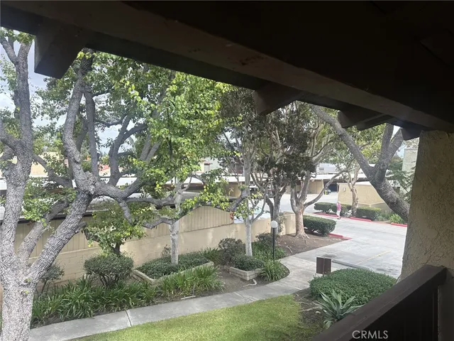 a bathroom with a granite countertop sink and a large mirror