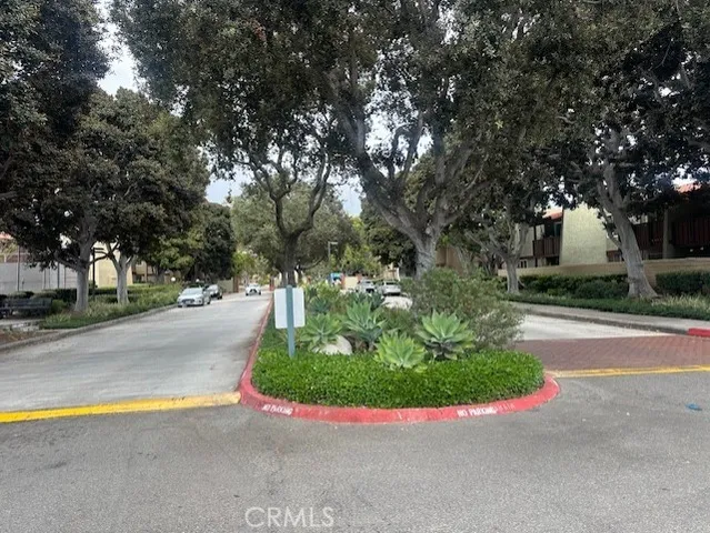 a view of a patio with couches table and chairs and potted plants