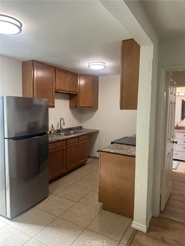 a kitchen with stainless steel appliances granite countertop a stove and a sink